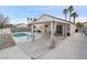 Backyard features a refreshing pool, pergola-covered patio, and ample space for outdoor entertaining at 414 Maritocca Ave, North Las Vegas, NV 89031