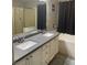 Main bathroom with double sinks, a shower, and a bathtub at 414 Maritocca Ave, North Las Vegas, NV 89031