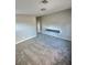 Bedroom features fresh gray paint and soft carpet flooring at 414 Maritocca Ave, North Las Vegas, NV 89031