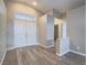 Inviting foyer with double doors, clerestory window and luxury vinyl plank flooring at 414 Maritocca Ave, North Las Vegas, NV 89031