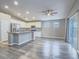 Modern kitchen with stainless steel appliances, granite countertops, and luxury vinyl plank flooring at 414 Maritocca Ave, North Las Vegas, NV 89031