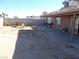 Landscaped backyard with covered patio and seating area at 4522 Checker Way, North Las Vegas, NV 89031