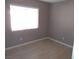 Bright bedroom with light walls and wood-look flooring at 4522 Checker Way, North Las Vegas, NV 89031