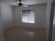 Spacious bedroom with ceiling fan and wood-look flooring at 4522 Checker Way, North Las Vegas, NV 89031