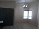 Bright dining area with tile flooring and a chandelier at 4522 Checker Way, North Las Vegas, NV 89031