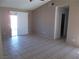 Spacious living room with tile flooring and sliding glass doors at 4522 Checker Way, North Las Vegas, NV 89031