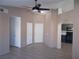 Open living area with tile floors, high ceilings, and neutral walls at 4522 Checker Way, North Las Vegas, NV 89031