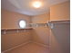 Walk-in closet with custom shelving and a window at 5066 El Castano Ave, Las Vegas, NV 89108