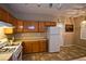 Kitchen features wood cabinets and gas range at 5066 El Castano Ave, Las Vegas, NV 89108