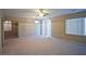 Bright living room with carpet, sliding doors and fan at 5066 El Castano Ave, Las Vegas, NV 89108