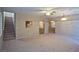 Living room with carpet, ceiling fan and stairs to upper level at 5066 El Castano Ave, Las Vegas, NV 89108