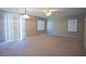 Bright living room with carpet, sliding doors and fan at 5066 El Castano Ave, Las Vegas, NV 89108