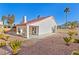 Landscaped backyard with patio and desert plants at 5112 Palm View Dr, Las Vegas, NV 89130