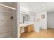 Bathroom with double vanity, large shower, and light wood cabinets at 5112 Palm View Dr, Las Vegas, NV 89130