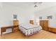 Bedroom with wood furniture, carpeted floors, and a ceiling fan at 5112 Palm View Dr, Las Vegas, NV 89130