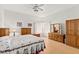 Main bedroom with wood furniture and carpeted floors at 5112 Palm View Dr, Las Vegas, NV 89130