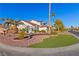 Landscaped front yard with mature plants and artificial turf at 5112 Palm View Dr, Las Vegas, NV 89130