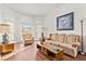 Bright living room featuring hardwood floors and comfy furniture at 5112 Palm View Dr, Las Vegas, NV 89130