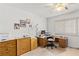 Bright home office features wood desk and ample storage at 5112 Palm View Dr, Las Vegas, NV 89130