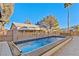 Inviting lap pool with cover and large patio at 5112 Palm View Dr, Las Vegas, NV 89130