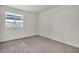 Spacious bedroom with neutral carpeting and large window at 5160 Indian River Dr # 329, Las Vegas, NV 89103