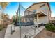 Large backyard with trampoline and covered patio at 6104 Talbot Springs Ct, North Las Vegas, NV 89081