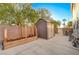 Backyard with shed, raised garden bed, and grassy area at 6104 Talbot Springs Ct, North Las Vegas, NV 89081