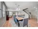 Open concept dining room with a staircase and hardwood floors at 6104 Talbot Springs Ct, North Las Vegas, NV 89081