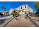 Two-story house with a palm tree and gravel landscaping at 6104 Talbot Springs Ct, North Las Vegas, NV 89081