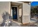 Front door entrance with a welcome mat and sidelights at 6104 Talbot Springs Ct, North Las Vegas, NV 89081