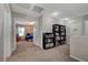 Bright hallway with built-in bookshelves leading to bedrooms at 6104 Talbot Springs Ct, North Las Vegas, NV 89081