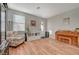 Living room with hardwood floors and floral armchair at 6104 Talbot Springs Ct, North Las Vegas, NV 89081