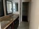 Bathroom with double vanity and granite countertop at 6201 E Lake Mead Blvd # 218, Las Vegas, NV 89156