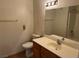 Clean bathroom with a toilet, sink, and bathtub at 6256 Hill Haven Ave, Las Vegas, NV 89130