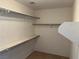 Large walk-in closet with double hanging rods and shelves at 6256 Hill Haven Ave, Las Vegas, NV 89130