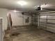 Two-car garage with storage shelving and an overhead door at 6256 Hill Haven Ave, Las Vegas, NV 89130