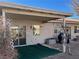 Covered patio with bird feeders and a view of the backyard at 6256 Hill Haven Ave, Las Vegas, NV 89130