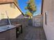 Side yard with storage shed and a paved pathway at 6256 Hill Haven Ave, Las Vegas, NV 89130