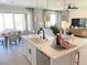 Large kitchen island with seating, white cabinets, and modern fixtures at 630 Moonbeam Way, Mesquite, NV 89027