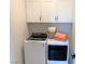 Bright laundry room with washer, dryer, and cabinets at 630 Moonbeam Way, Mesquite, NV 89027