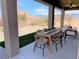 Covered patio with seating area and mountain views at 630 Moonbeam Way, Mesquite, NV 89027