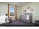 Bright Bedroom with a crib, rocking chair, and large window at 646 Bellus Pl # Lot 181, Henderson, NV 89015