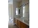 Double vanity bathroom with wood cabinets and tiled floor at 6617 Old Newbury Ave, Las Vegas, NV 89108