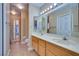 Bathroom with double vanity and tiled floor at 6617 Old Newbury Ave, Las Vegas, NV 89108