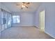 Spacious bedroom with carpeted floor and ceiling fan at 6617 Old Newbury Ave, Las Vegas, NV 89108