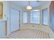 Bright breakfast nook features tiled flooring and a view from the large window at 6617 Old Newbury Ave, Las Vegas, NV 89108