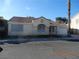 Single-story house with tile roof, screened windows, and a two-car garage at 6617 Old Newbury Ave, Las Vegas, NV 89108