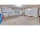 Two-car garage with overhead door and storage cabinets at 6617 Old Newbury Ave, Las Vegas, NV 89108