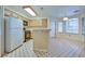 Galley kitchen with light wood cabinets and a breakfast nook at 6617 Old Newbury Ave, Las Vegas, NV 89108