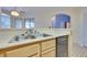 Kitchen with double sink, dishwasher and light wood cabinets at 6617 Old Newbury Ave, Las Vegas, NV 89108